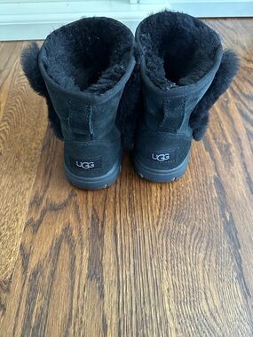 UGG Black Short Shearling Boot with Pom Detail